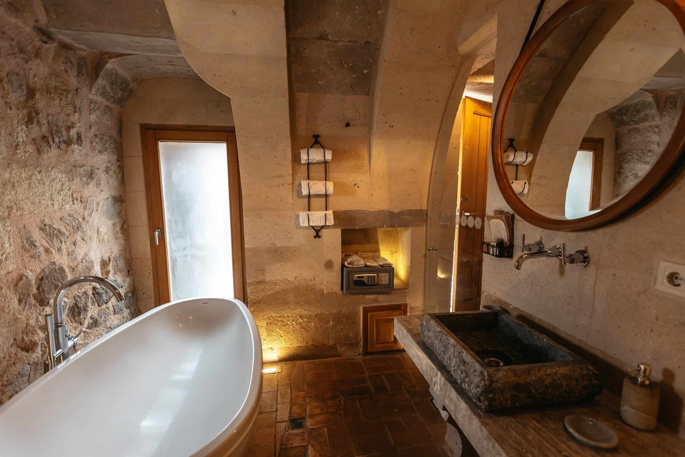 Standard Room: bathroom with freestanding bathtub and stone basin
