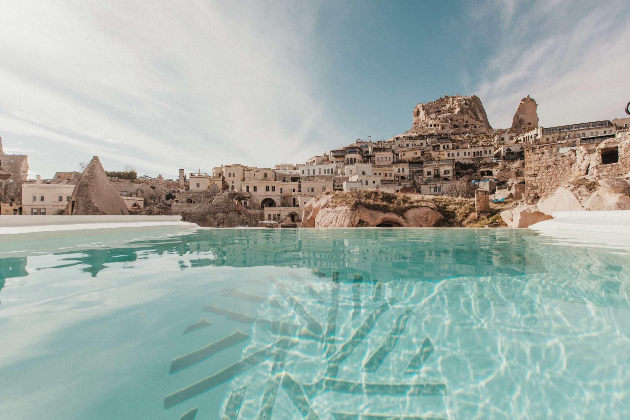 Pool Suite With View: outdoor pool with a view of Uçhisar Castle