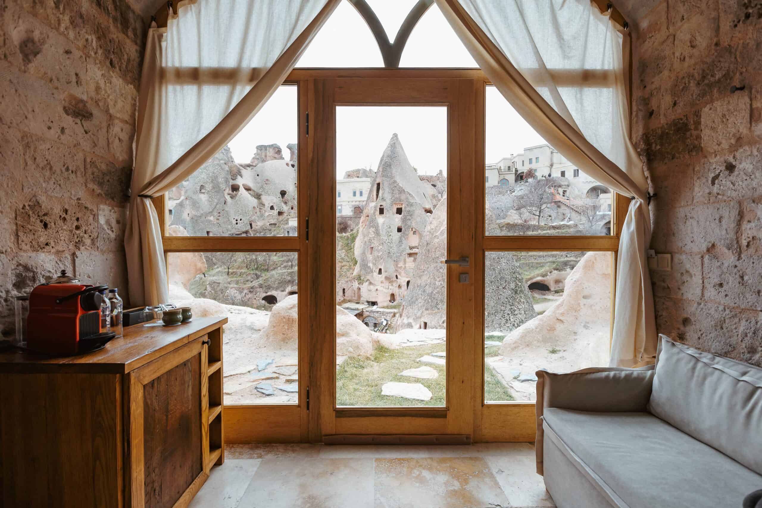 Junior Suite with View: window overlooking the rock houses of Uçhisar