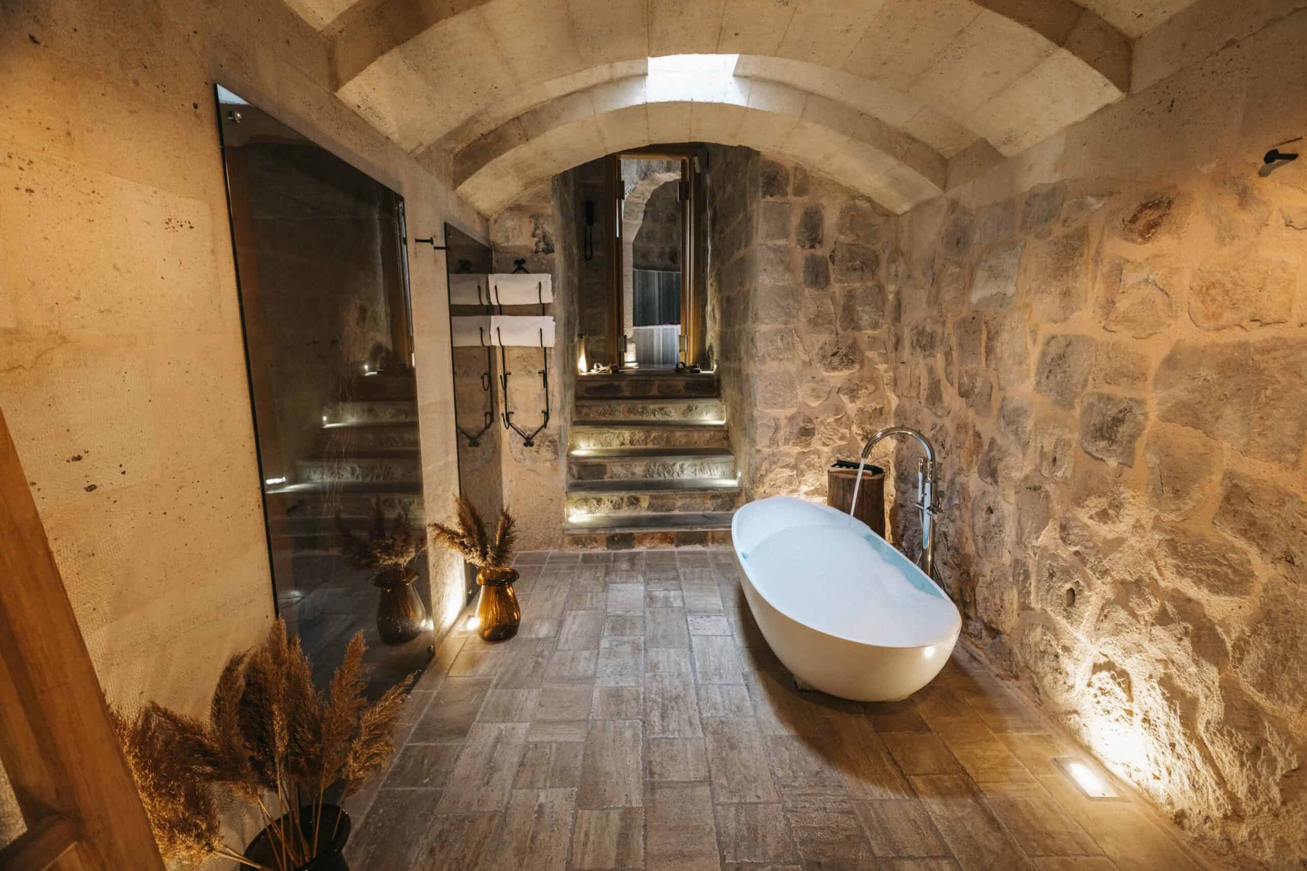 Suite With a View: freestanding bathtub in a stone vault