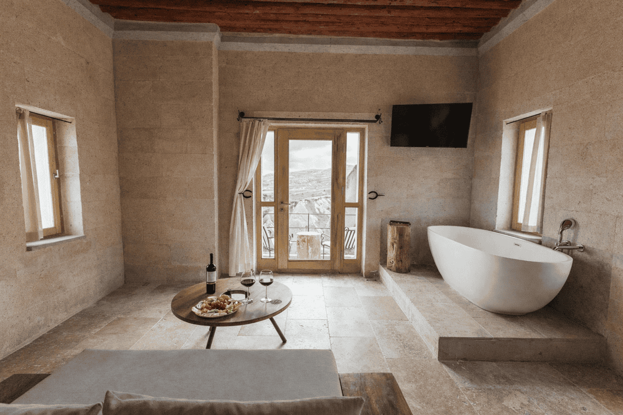 Suite With Balcony: freestanding bathtub and balcony door