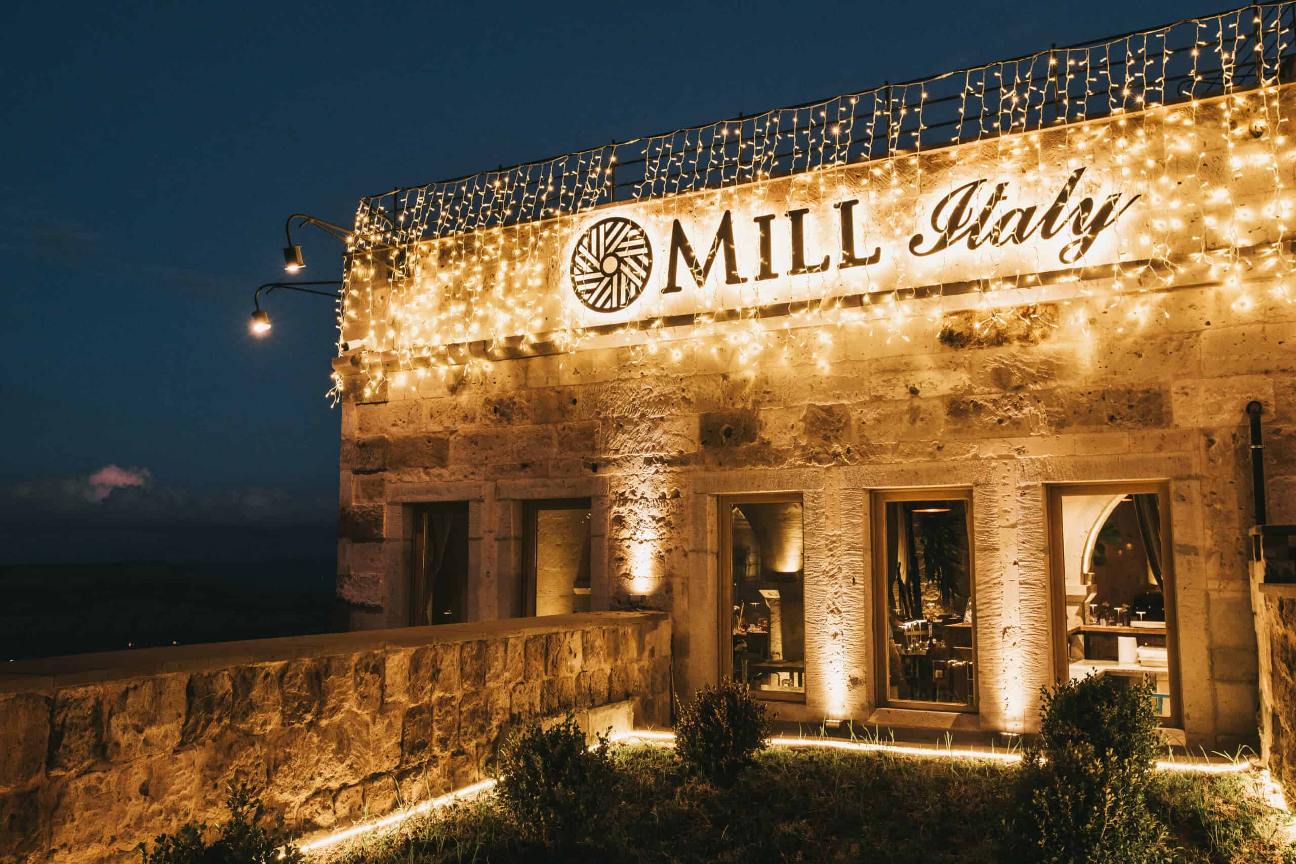 Mill Italy restaurant facade lit up at night