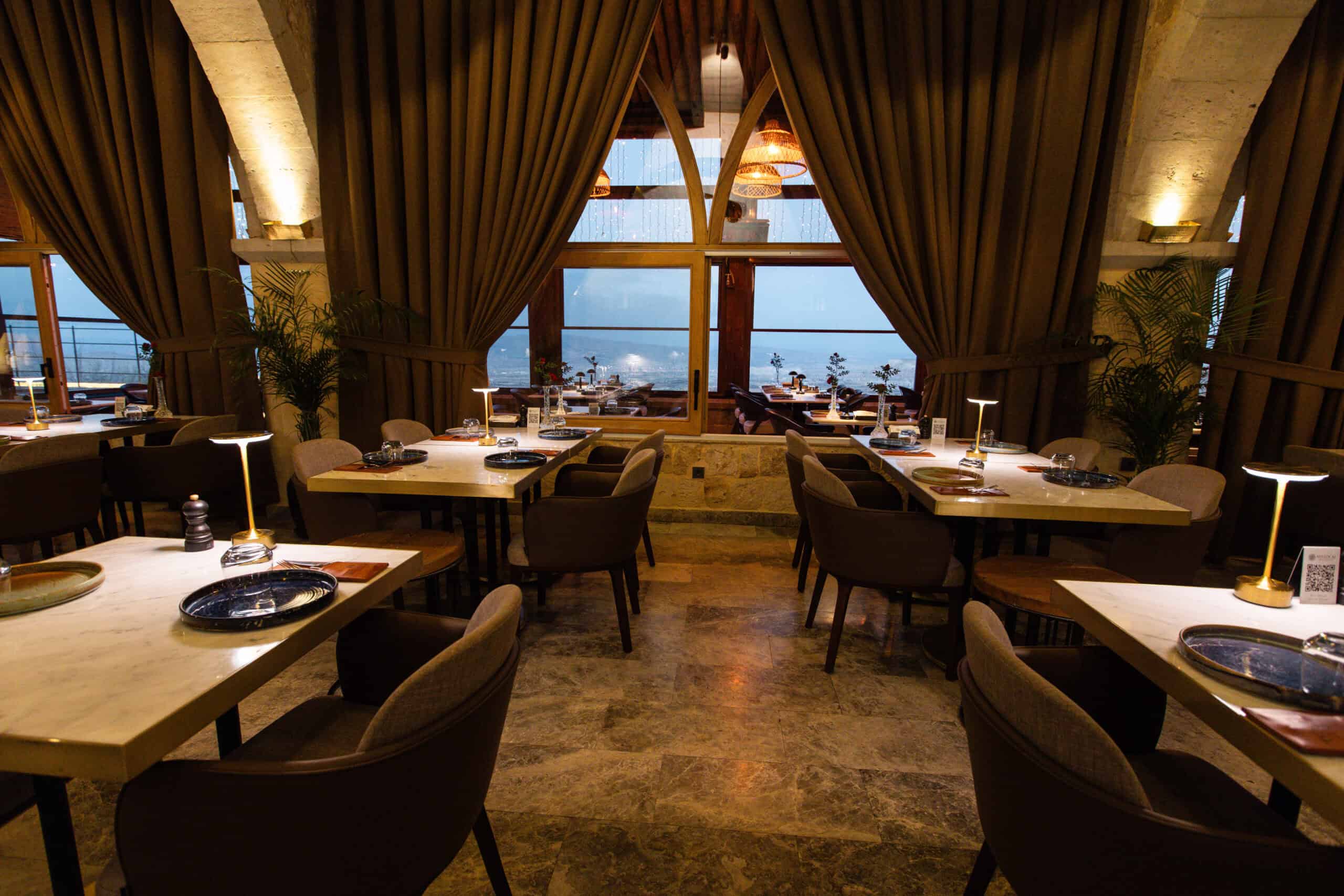 Millocal tables by large windows