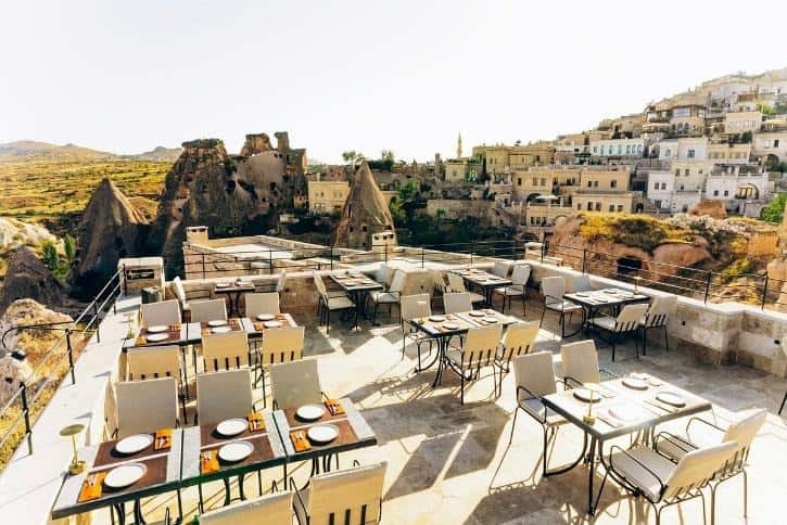 Outdoor terrace set for an event overlooking Uçhisar