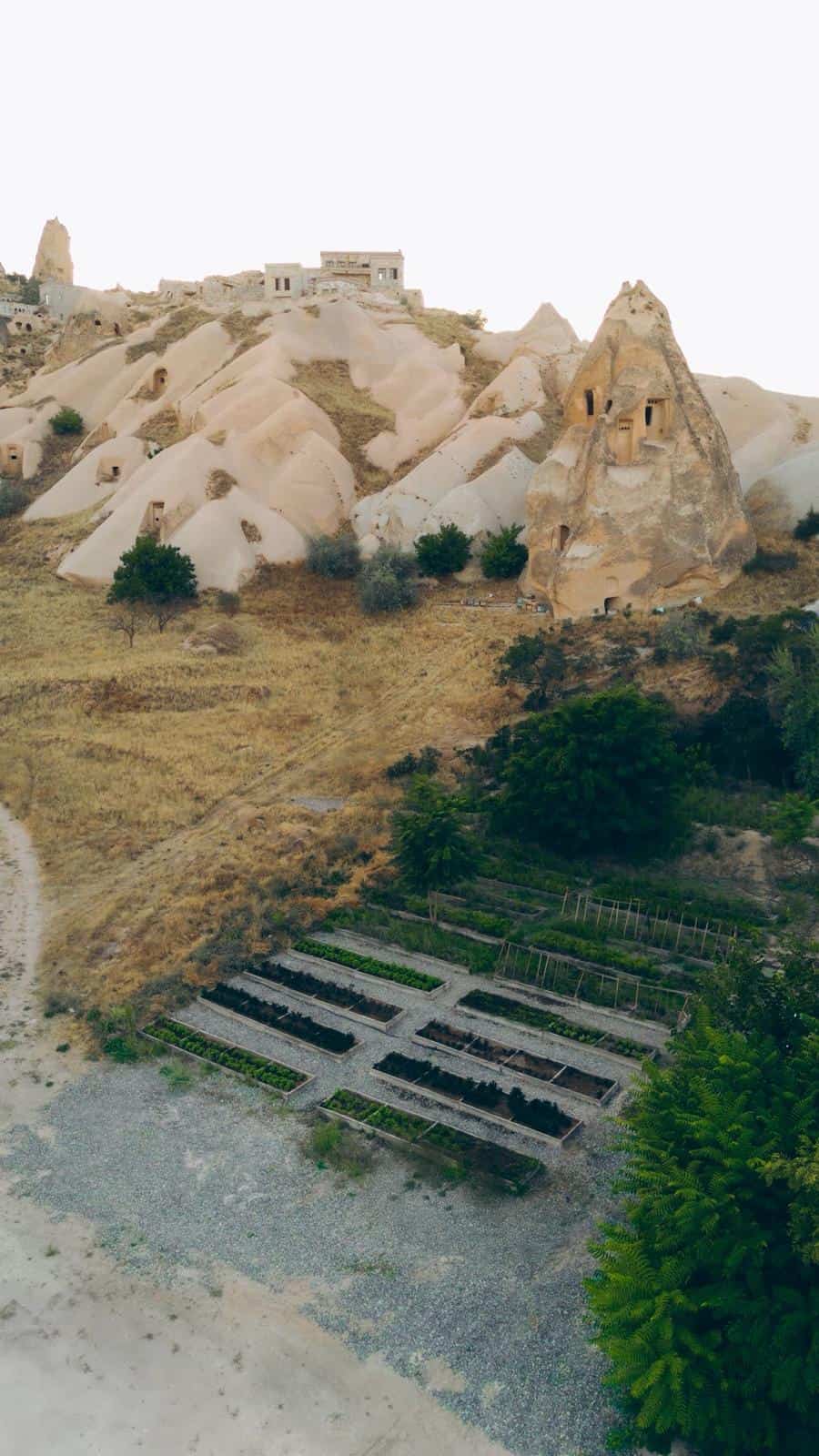 Hotel garden terraces overlooking Cappadocia's rock formations