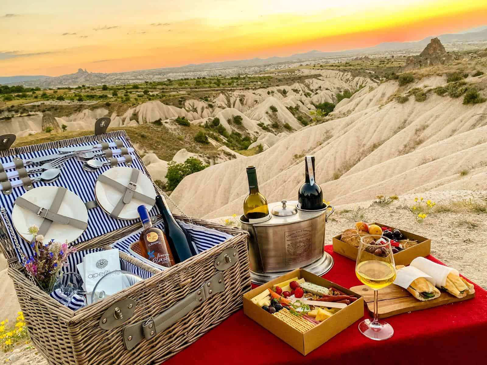 Sunset picnic basket with wine overlooking the valleys of Cappadocia