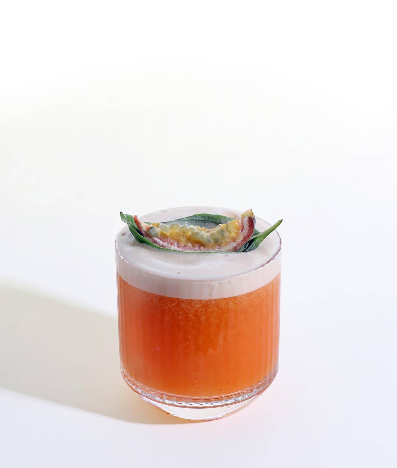 Orange signature cocktail with garnish