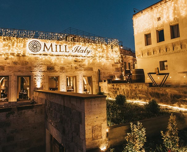 Mill Italy terrace and illuminated facade at night