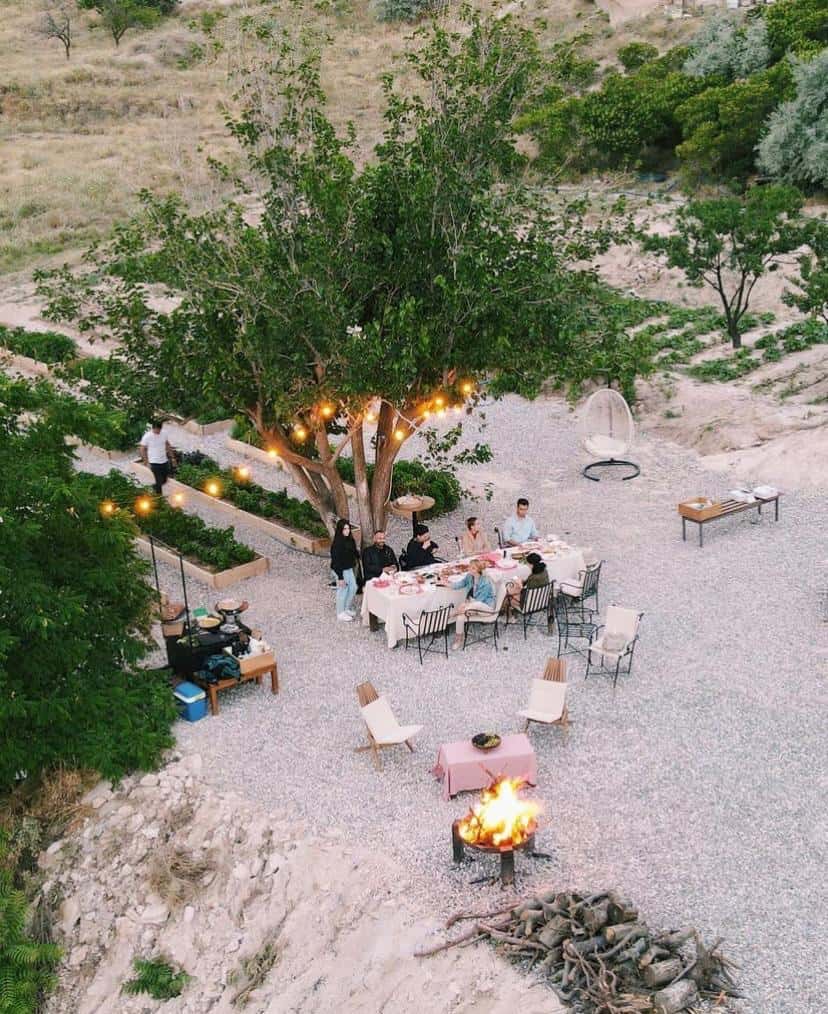 Aerial view of a garden dinner among the trees